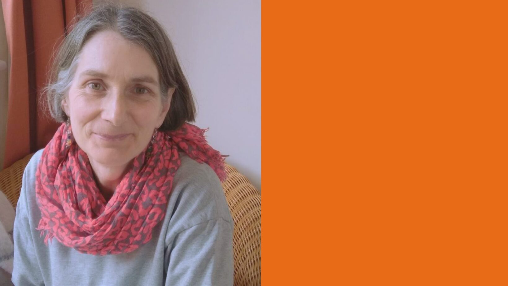 ursula-orange button wearer